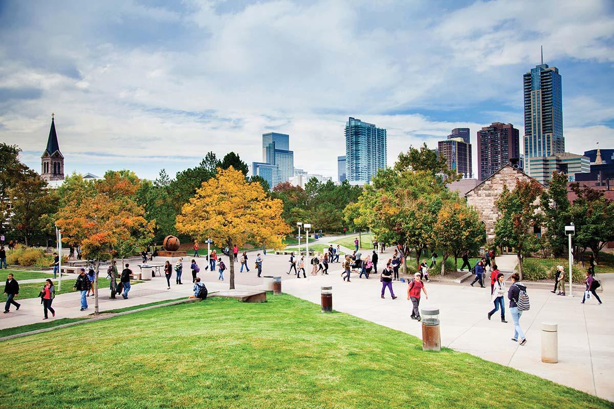 Students walking through a sunny Auraria Campus.